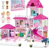 A large, multi-story pink dollhouse with accessories, dolls, and toy dogs. Voir les images du produit
