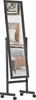 A full-length mirror on a stand with wheels, reflecting a bedroom scene. Náhled obrázku produktu