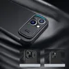 A close-up shot of a black phone case with a camera cover, resting on a textured black surface. Produktbild-Vorschau
