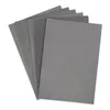 A stack of gray sheets of paper, likely sandpaper, fanned out on a white background. Voir les images du produit