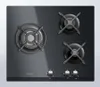 A top-down view of a black gas stovetop with three burners and control knobs. Anteprima dell’immagine prodotto