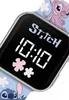 Close-up of a digital watch face with Stitch and Angel characters on the strap. Voir les images du produit