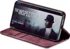 A smartphone in a burgundy flip case is displayed, showing a movie streaming interface on its screen. Produktbild-Vorschau
