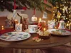 A festive Christmas table setting with holiday-themed tableware and decorations. Produktbild-Vorschau