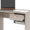 A close-up view of a desk with a laptop and an open drawer. Náhled obrázku produktu
