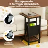 A C-shaped side table with a laptop on top, placed next to a sofa. The image highlights the wheels and storage features of the table. Voir les images du produit