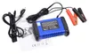 A blue battery charger with red and black clamps is shown on a white background, along with its manual and power cord. Náhľad obrázku produktu