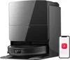 A black robot vacuum cleaner with its charging dock and a smartphone displaying an app interface. Produktbild-Vorschau