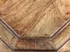 A close-up view of a wooden table top with a textured, rustic finish. Produktbild-Vorschau