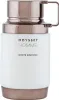 A product shot of a white and bronze perfume bottle. Voir les images du produit
