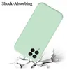 A light green phone case is shown falling onto a cracked white surface, illustrating its shock-absorbing feature. Produktbild-Vorschau