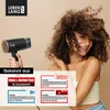 A woman with curly hair is smiling and touching her hair, while a hairdryer is held by a hand in the foreground. Several logos and text boxes indicating media mentions are present. Produktbild-Vorschau