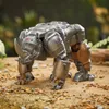 A toy rhinoceros robot in a naturalistic outdoor setting. Anteprima dell’immagine prodotto