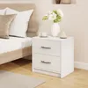 A white nightstand with two drawers next to a bed. Podgląd zdjęcia produktu