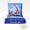 A folded duvet cover and pillowcase set with a police and fire truck theme, displayed on a white background. Produktbild-Vorschau