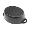 The underside of a black cast iron pot with handles is shown against a white background. Anteprima dell’immagine prodotto