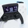 A close-up of a white and black PlayStation controller with a digital display showing the time and date. Náhled obrázku produktu