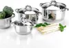 A set of stainless steel pots with glass lids, along with fresh broccoli and asparagus, arranged on a white reflective surface. Náhled obrázku produktu