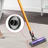 A close-up of a vacuum cleaner head on a carpet, with magnified insets showing details of the vacuum's attachments. Náhled obrázku produktu