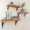 Three wooden shelves mounted on a white wall, decorated with various items. Produktbild-Vorschau