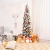 A decorated Christmas tree with gifts and festive decorations in a room. Produktbild-Vorschau
