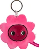A close-up of a pink flower-shaped keychain with a smiling face. Produktbild-Vorschau