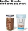 Two food storage containers are shown against a white background. The container on the left is a clear, square-shaped container filled with brown dry goods, likely granola or beans. The container on the right is a translucent, flexible container with a blu Náhled obrázku produktu