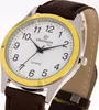 A close-up, angled shot of a wristwatch with a white face, gold bezel, and brown leather strap. Produktbild-Vorschau