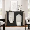 A black console table with arched cutouts is placed in a room with two chairs and a framed picture on the wall. Produktbild-Vorschau