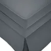 A close-up view of the corner of a dark gray upholstered chaise lounge. Podgląd zdjęcia produktu