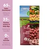 A bag of dog food with a collage of ingredients and a landscape scene. Produktbild-Vorschau