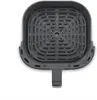 An overhead view of an empty air fryer basket. Produktbild-Vorschau