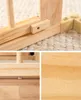 Collage of close-up shots of a wooden baby playpen, showing construction details and wood grain. Voir les images du produit