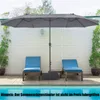 A large gray patio umbrella is set up over two blue lounge chairs next to a swimming pool. Podgląd zdjęcia produktu