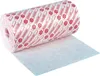 A roll of white adhesive fleece with red repeating patterns is shown, with a section unrolled onto a white surface. Náhled obrázku produktu