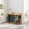 A laundry organizer with multiple compartments and storage boxes in a room setting. Voir les images du produit