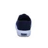 The back view of a navy blue Superga sneaker with a white sole. Produktbild-Vorschau