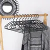 Dix cintres rotatifs en plastique noir - solution pratique Voir les images du produit 6