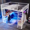 A loft bed with a desk and storage, illuminated by blue and purple LED lights, set up in a modern bedroom or gaming room. Produktbild-Vorschau