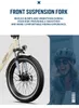 A close-up of an electric bicycle's front suspension fork and wheel, with a woman wearing a helmet in the background. Produktbild-Vorschau