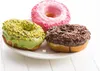 Three donuts on a white plate. Produktbild-Vorschau