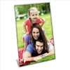 A family is posing for a photo in a park. Náhľad obrázku produktu