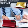 People working at a desk with a phone case and phone. Produktbild-Vorschau