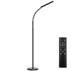 A black floor lamp and a remote control are shown against a white background. Náhled obrázku produktu