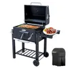 A black charcoal grill with the lid open, showing food cooking on the grates. A plate of cooked steak and vegetables is on a side table. A grill cover is shown separately. Anteprima dell’immagine prodotto