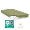 A fitted sheet on a mattress, with certification logos and care instructions. Produktbild-Vorschau