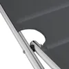 A close-up view of the corner of a gray fabric lounger with silver metal frame. Náhled obrázku produktu