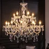 A close-up view of a crystal chandelier against a dark background. Náhled obrázku produktu