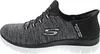 Side view of a single black and gray Skechers slip-on shoe. Podgląd zdjęcia produktu