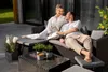 A couple relaxing on a patio furniture set. Náhled obrázku produktu